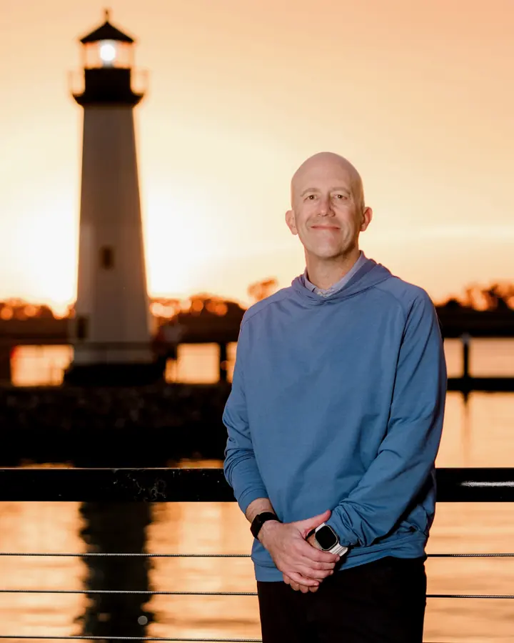 Brian Feragotti at the harbor at sunset